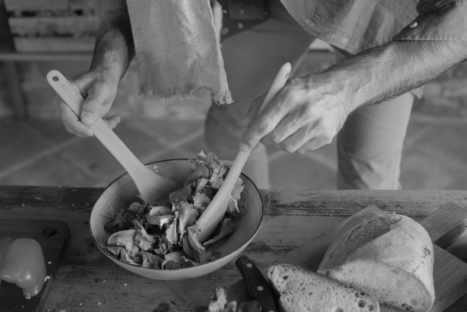 Man Mixing Vegetables in a Bowl